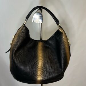 Calvin Klein luxury handbag purse. Black and gold with logo gold hardware